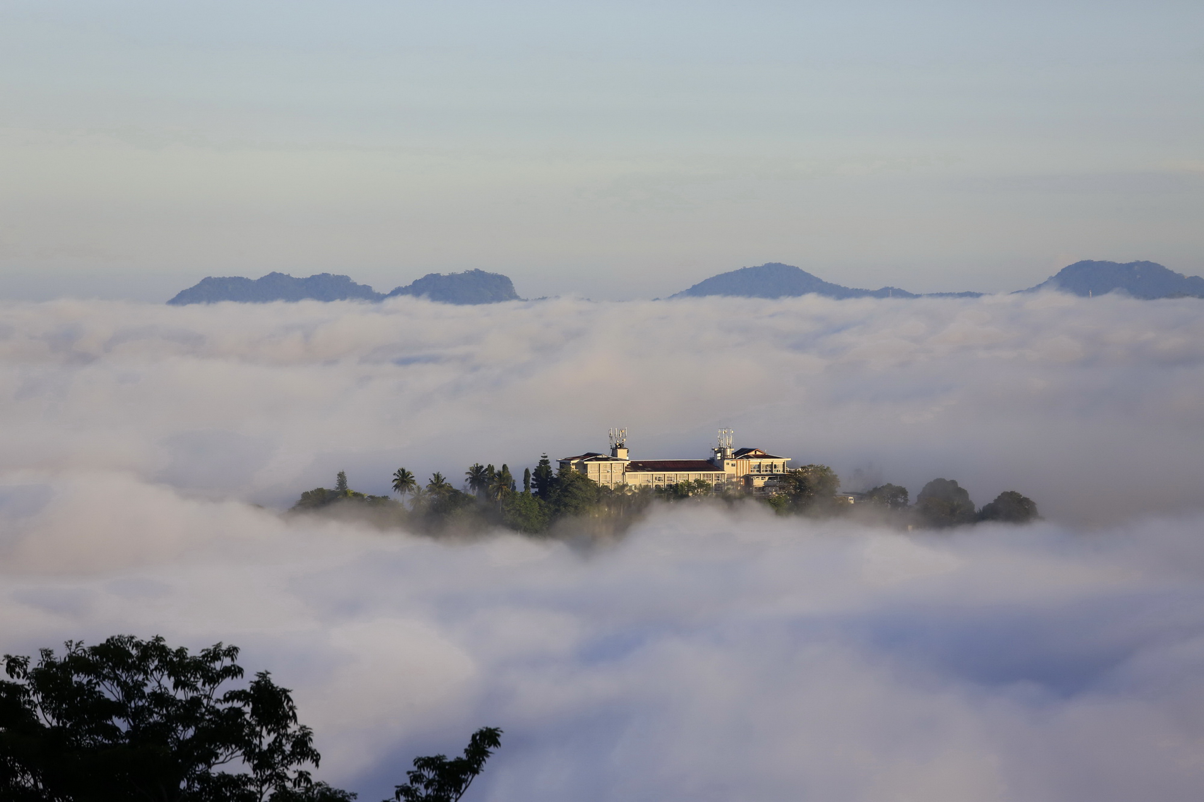 From a mountain in Sri Lanka, with a 30-second window, patience and a second opportunity enabled me to capture this rare, heavenly visual delight; Kandy, Sri Lanka.