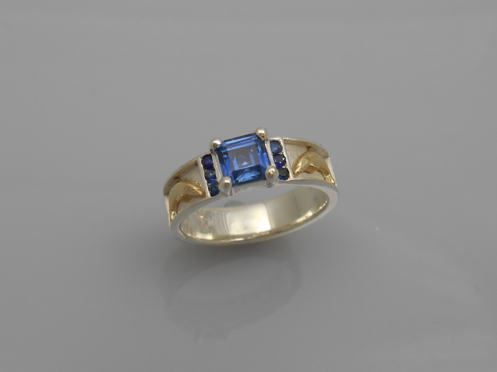 Silver and 14k gold reef ring with sapphire
